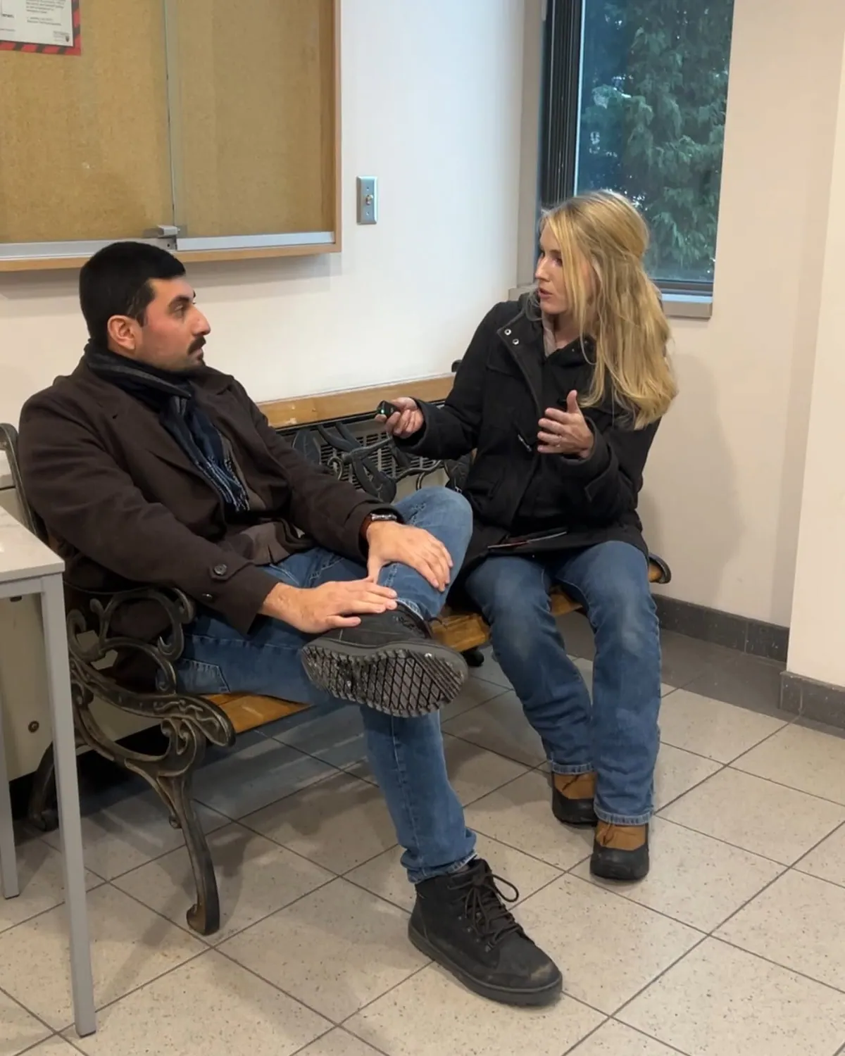 A quiet one-on-one conversation about faith on a bench